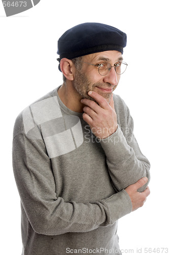 Image of aging artist thinking with beret hat