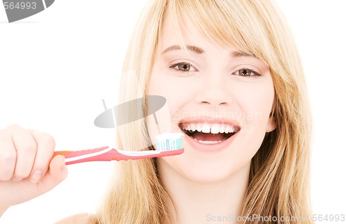 Image of happy girl with toothbrush