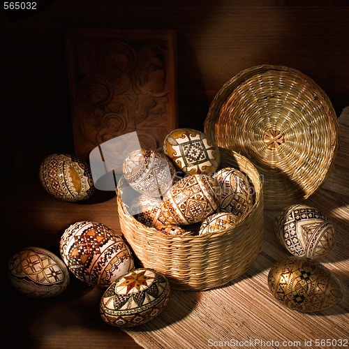 Image of handmade brown romanian decorated easter egg still-life