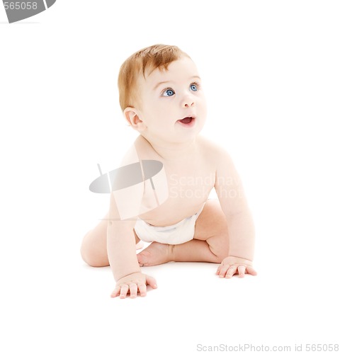 Image of crawling baby boy in diaper