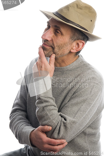 Image of middle age man adventure hat thinking