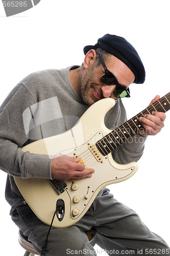 Image of middle age man playing guitar musician