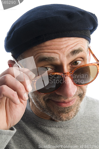 Image of aging artist thinking distorted nose close up beret hat