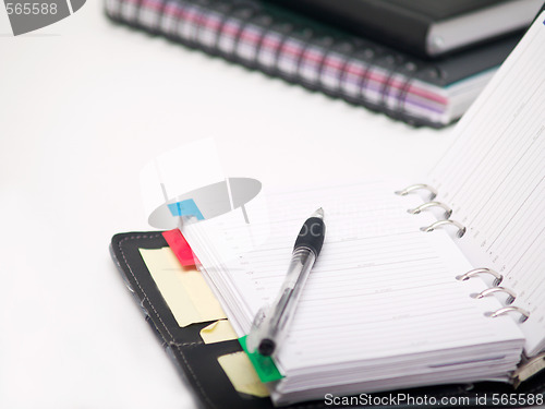 Image of Office stationary - Pen and diary on white