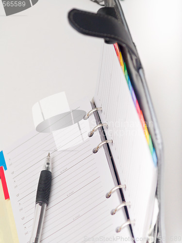 Image of Office stationary - Pen and diary on white