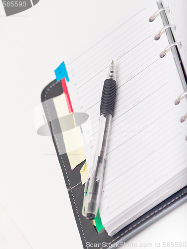 Image of Office stationary - Pen and diary on white