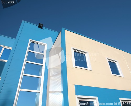 Image of bright blue-beige building