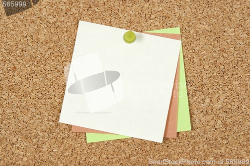 Image of Post-it notes pinned to corkboard