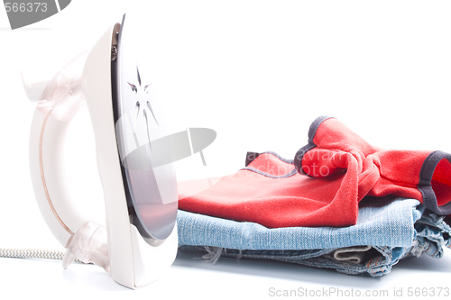 Image of electric iron and pile of clothes