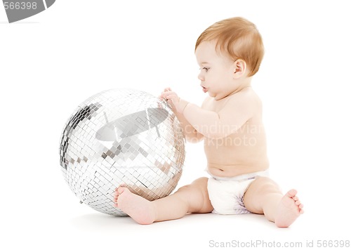 Image of adorable baby boy with big disco ball