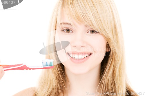 Image of happy girl with toothbrush