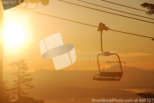 Image of Chair lift in sunrise