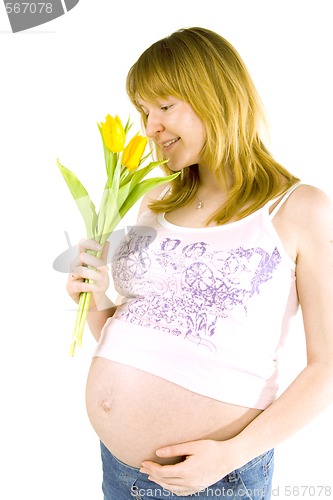 Image of pregnant woman with yellow tulips