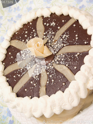 Image of Delicous sweet layer cake with chocolate icing