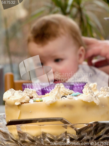 Image of Birthday cake and baby boy on his birthday