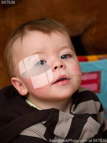 Image of Cute little  baby boy looking up 