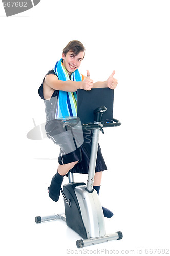 Image of Young boy doing fitness and studying