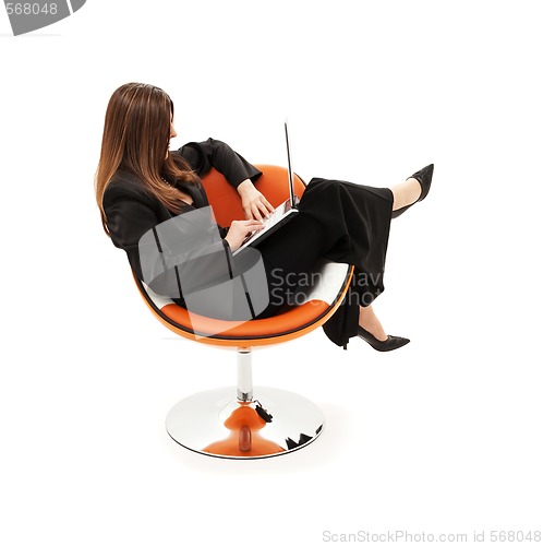 Image of businesswoman in chair with laptop