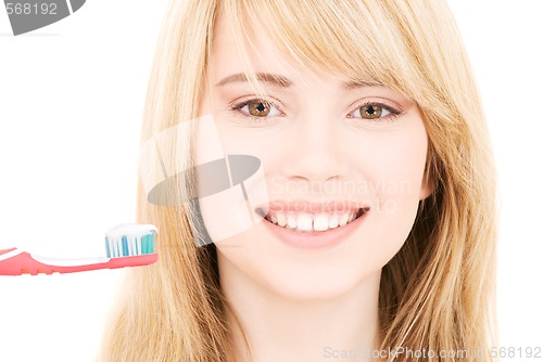 Image of happy girl with toothbrush