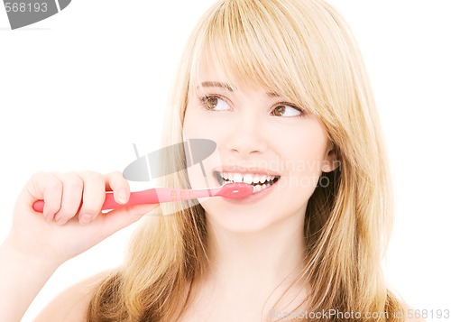 Image of happy girl with toothbrush