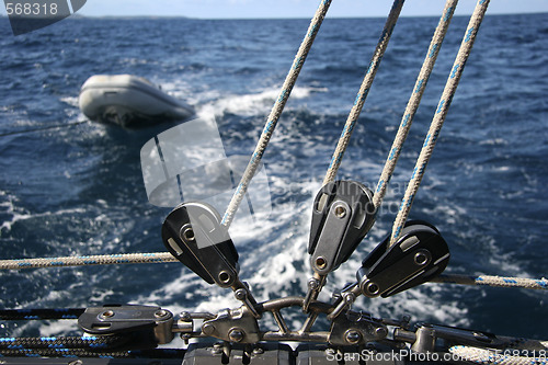 Image of Winch with rope and a dinghy