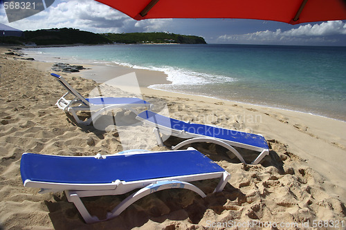 Image of Red parasol with loung chair
