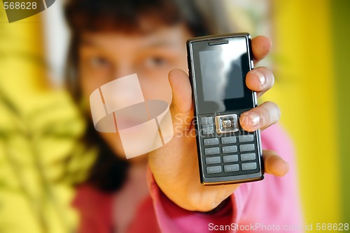 Image of Teen girl showing her mobile phone