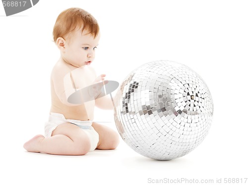 Image of adorable baby boy with big disco ball