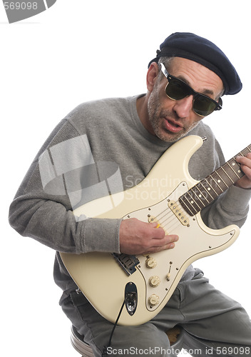 Image of senior man playing guitar