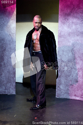 Image of handsome male black african american actor pimp outfit on stage