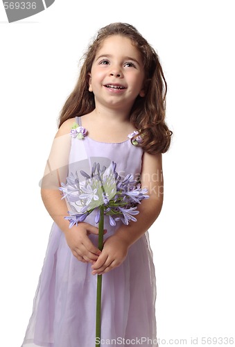 Image of Pretty girl with beautiful flower smiling