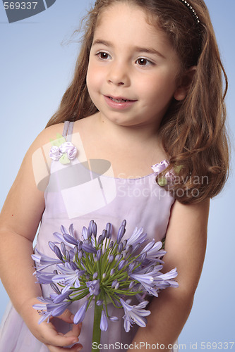 Image of Sweet girl with lily flower