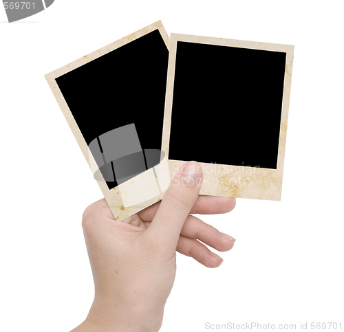 Image of two photo frames in a hand 