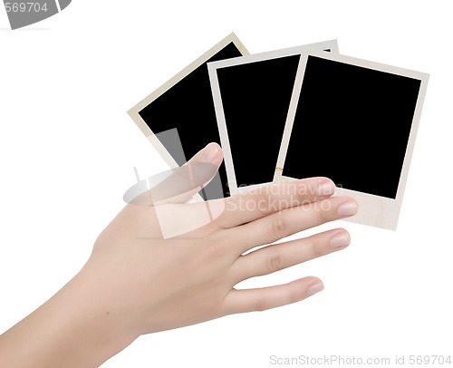 Image of three photo frames in a hand