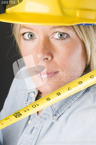 Image of pretty blond female construction worker hard hat helmet
