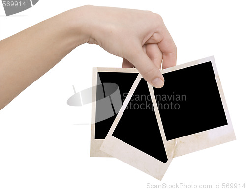 Image of three photo frames in a hand