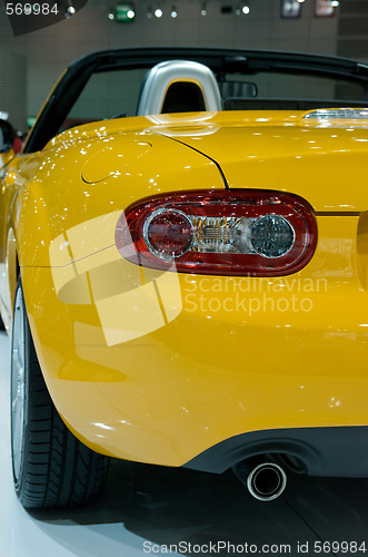 Image of rear detail of yellow sportscar