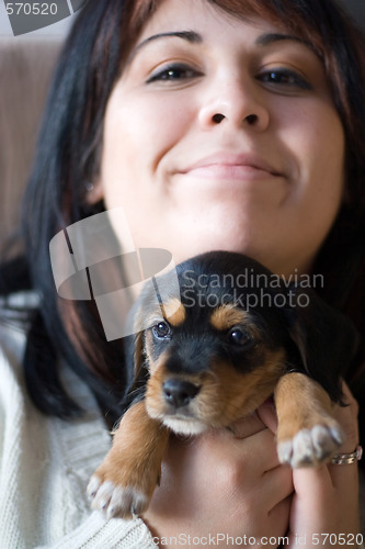 Image of Woman Holding a Puppy