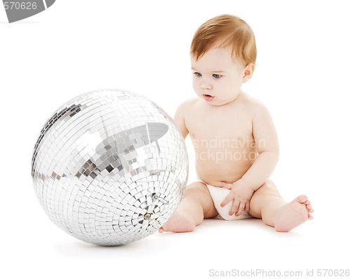 Image of adorable baby boy with big disco ball