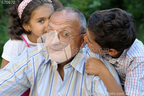 Image of Happy grandfather and kids
