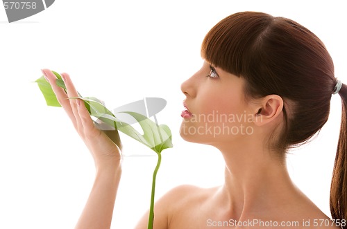 Image of woman with green leaf