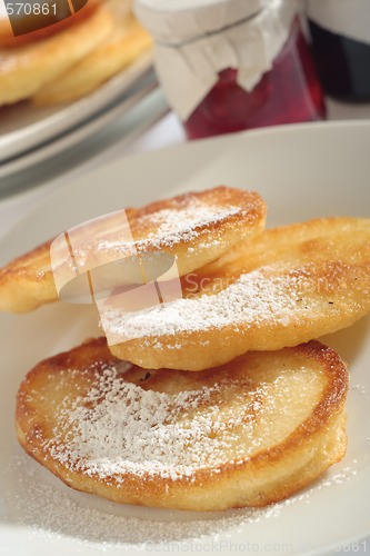 Image of Polish doughnuts with sugar icing