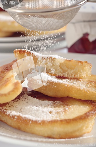 Image of Polish doughnuts with icing sugar