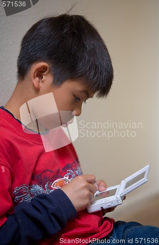 Image of Boy playing video game