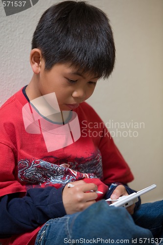 Image of Boy playing video game