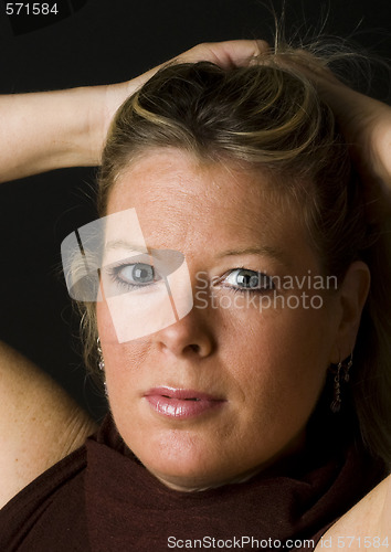 Image of attractive blond middle age woman with hair up