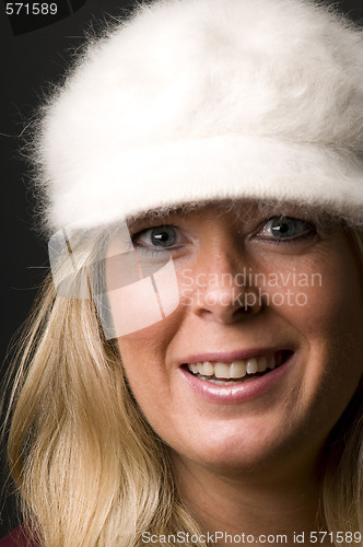 Image of blond woman head shot with fashion hat