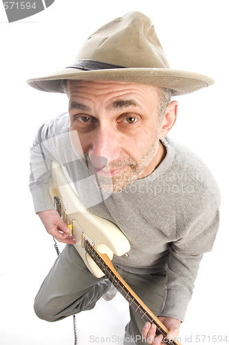 Image of senior man playing guitar