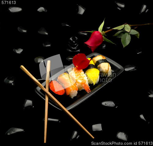 Image of assorted sushi plate and rose