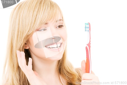 Image of happy girl with toothbrush